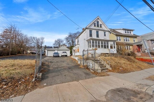 153-157 Stuyvesant Ave, Newark City, NJ 07106 - view of front of property featuring a garage and an outdoor structure
