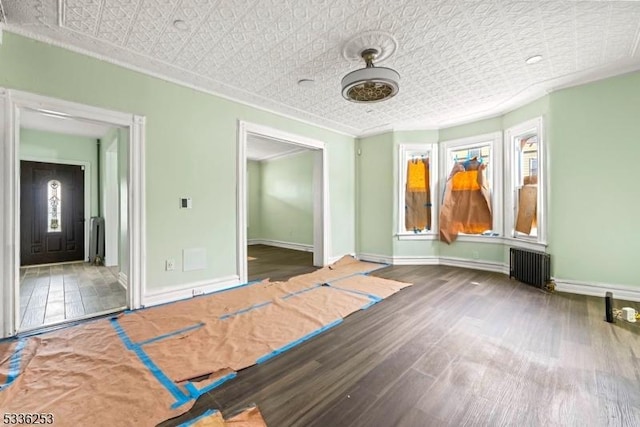 153-157 Stuyvesant Ave, Newark City, NJ 07106 - empty room featuring dark wood-type flooring, radiator heating unit, and crown molding