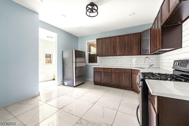 153-157 Stuyvesant Ave, Newark City, NJ 07106 - kitchen featuring stainless steel appliances, dark brown cabinets, sink, and decorative backsplash