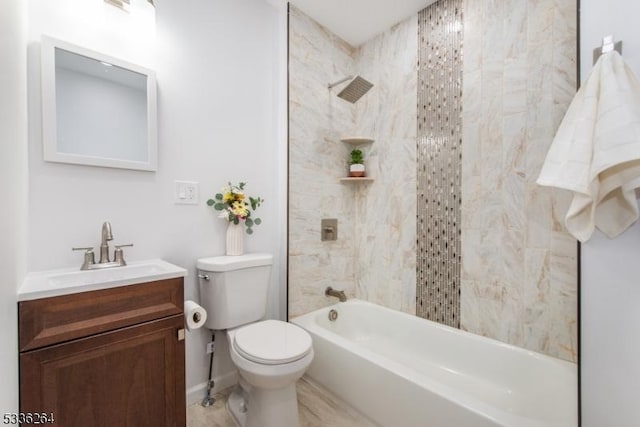 full bathroom with vanity, tiled shower / bath combo, and toilet