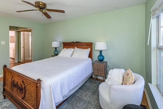 bedroom featuring ceiling fan and dark hardwood / wood-style flooring