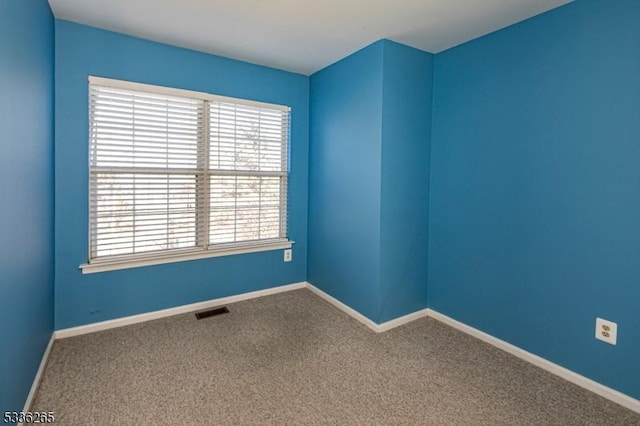 view of carpeted spare room