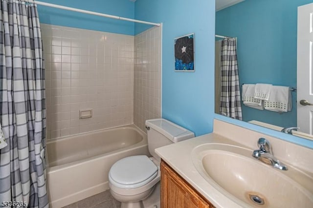 full bathroom featuring vanity, tile patterned flooring, toilet, and shower / bath combo