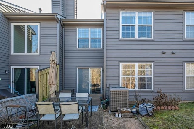 back of house featuring cooling unit and a patio area