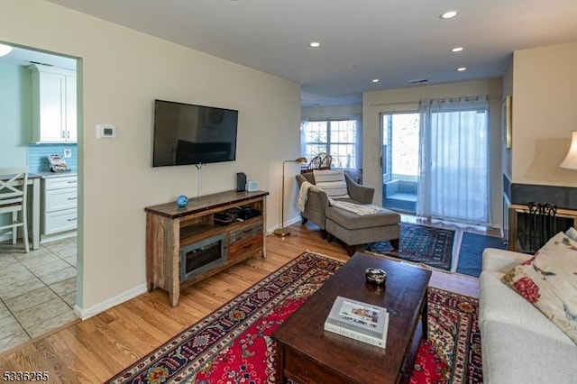 living room with light hardwood / wood-style floors