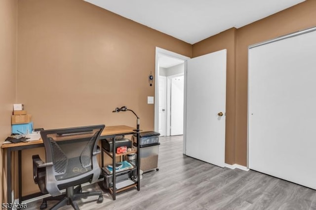 office area with wood-type flooring