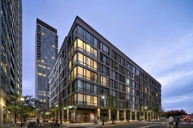 view of outdoor building at dusk