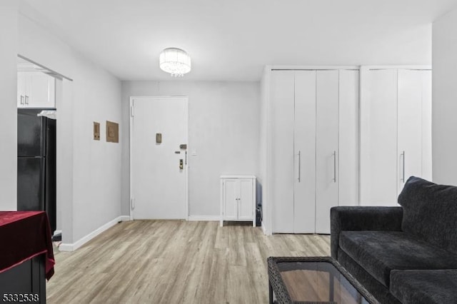 living area with light hardwood / wood-style flooring