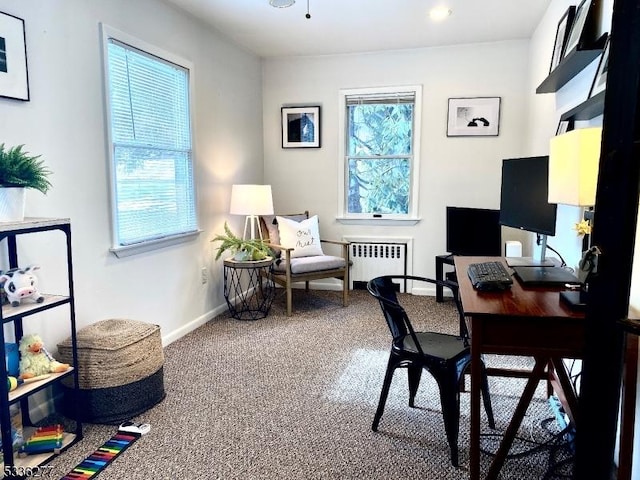 carpeted office featuring radiator heating unit