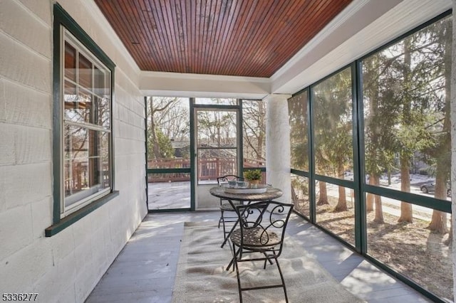 unfurnished sunroom featuring wooden ceiling