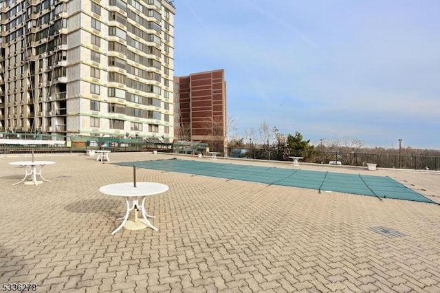 view of swimming pool featuring a patio