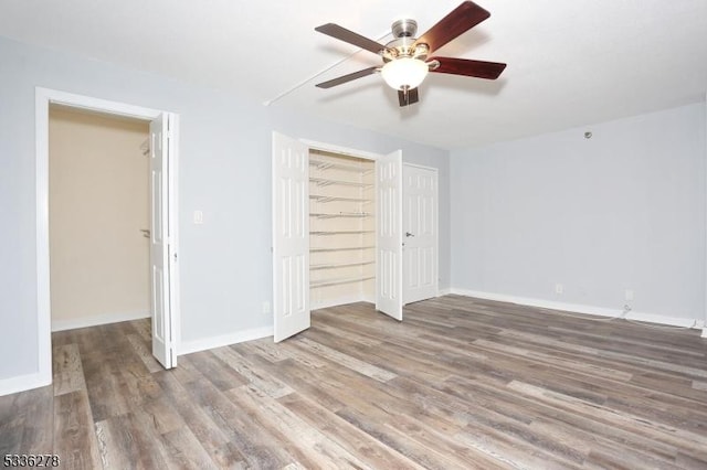 unfurnished bedroom with hardwood / wood-style flooring and ceiling fan