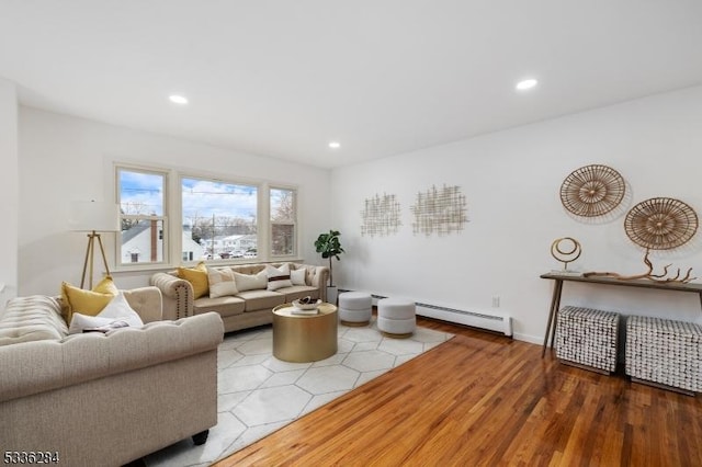 living room with light hardwood / wood-style flooring and baseboard heating