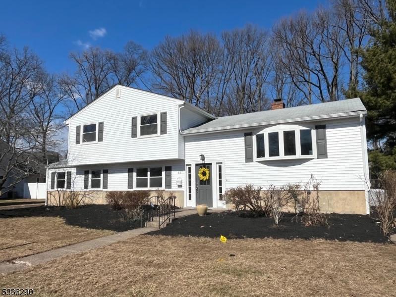 split level home featuring a chimney