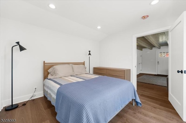 bedroom featuring recessed lighting, lofted ceiling with beams, and wood finished floors