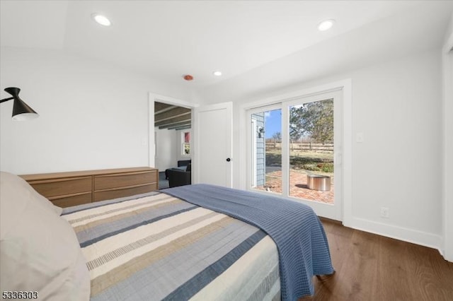 bedroom with access to outside, recessed lighting, wood finished floors, and baseboards