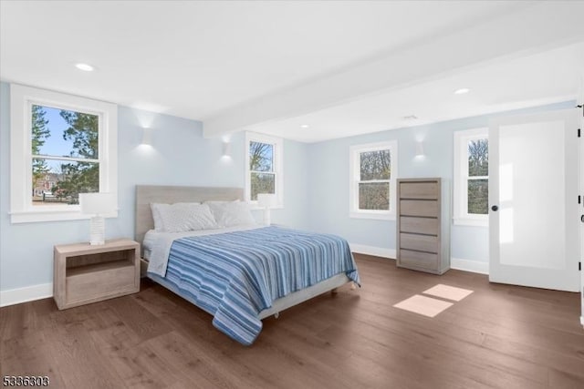 bedroom featuring beam ceiling, recessed lighting, wood finished floors, and baseboards