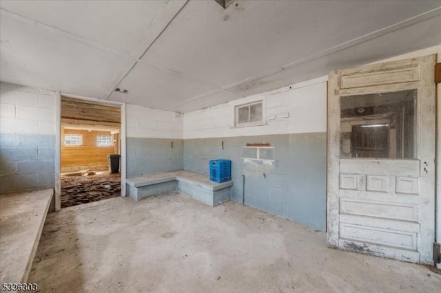 interior space featuring concrete block wall