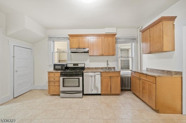 kitchen with sink, radiator heating unit, and stainless steel appliances