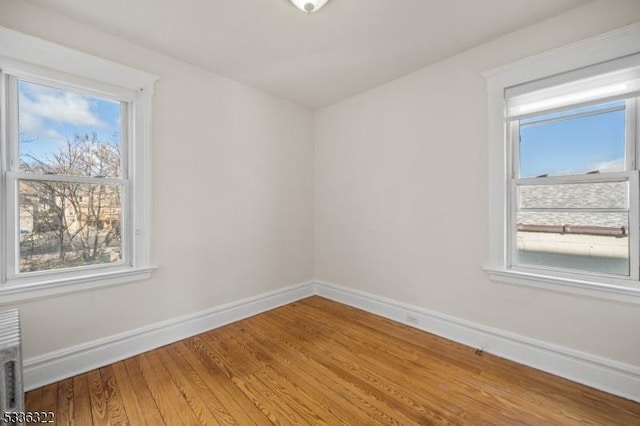 empty room featuring hardwood / wood-style flooring