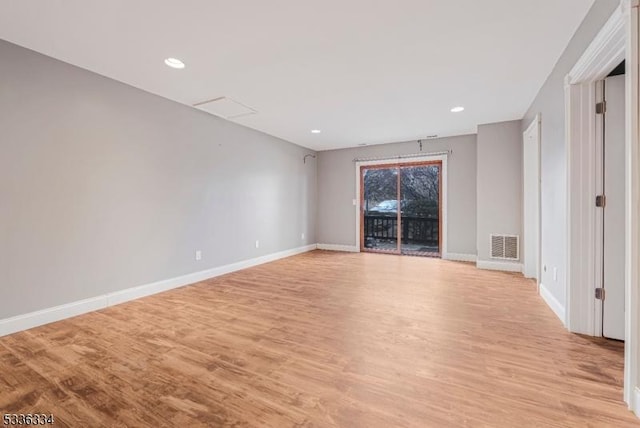 unfurnished room with light wood-type flooring