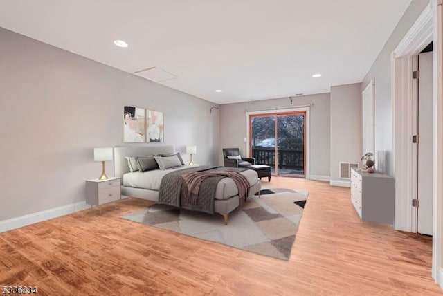 bedroom with light hardwood / wood-style flooring and access to outside