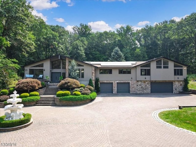 view of front of property with a garage