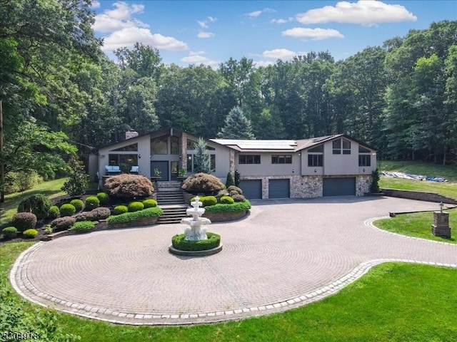 view of front of property with a garage