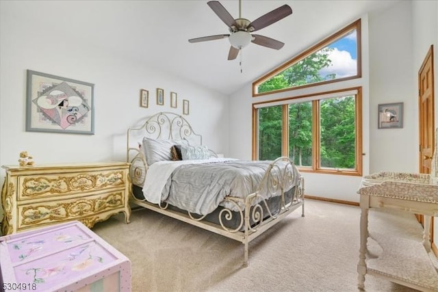 carpeted bedroom featuring vaulted ceiling and ceiling fan