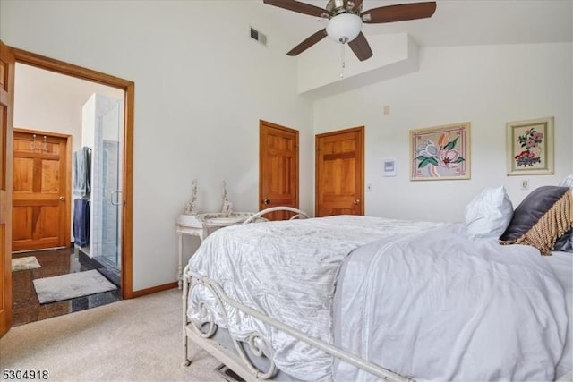 carpeted bedroom featuring a towering ceiling and ceiling fan