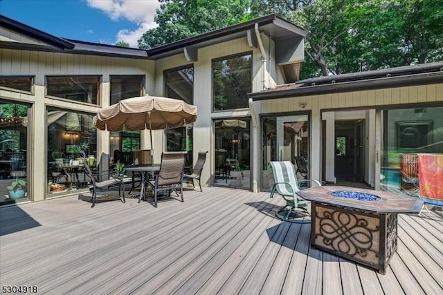 deck with an outdoor fire pit