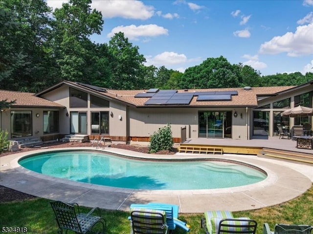 view of swimming pool featuring a deck