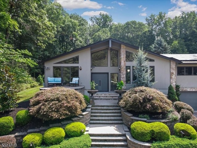 contemporary home featuring outdoor lounge area