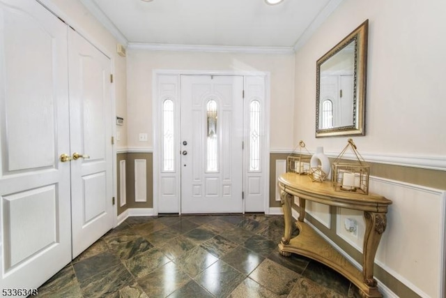 foyer entrance featuring ornamental molding