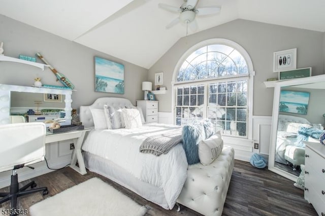 bedroom featuring dark hardwood / wood-style flooring, lofted ceiling, and ceiling fan