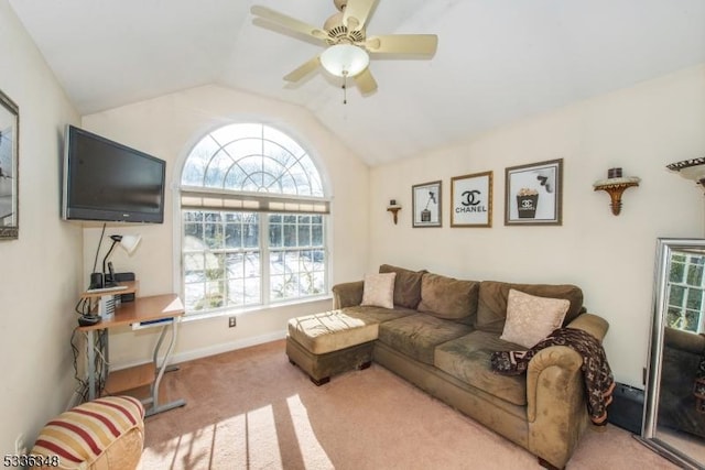 carpeted living room with vaulted ceiling and ceiling fan