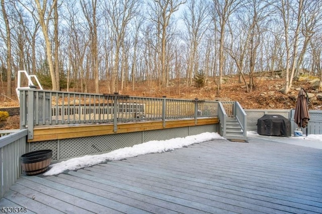 wooden deck featuring area for grilling