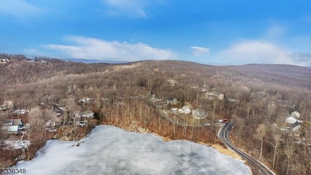 snowy aerial view with a mountain view