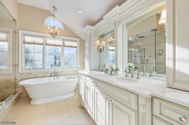 full bathroom with a chandelier, tile patterned flooring, a sink, and a shower stall