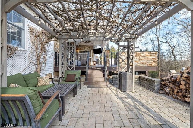 view of patio featuring an outdoor hangout area, a pergola, and a wooden deck