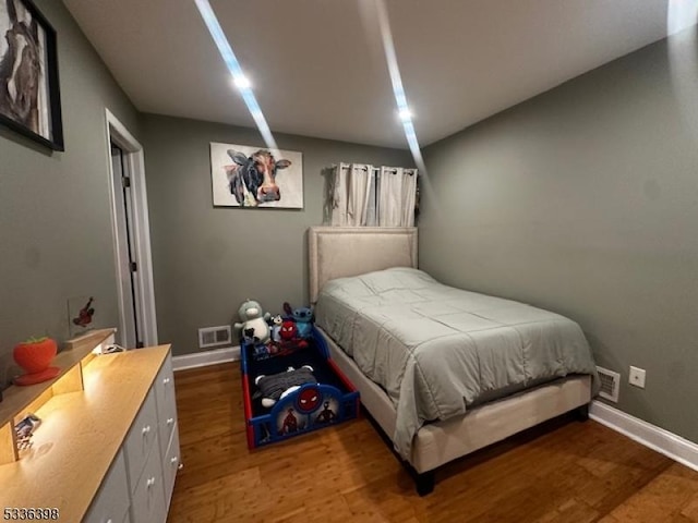 bedroom featuring hardwood / wood-style floors