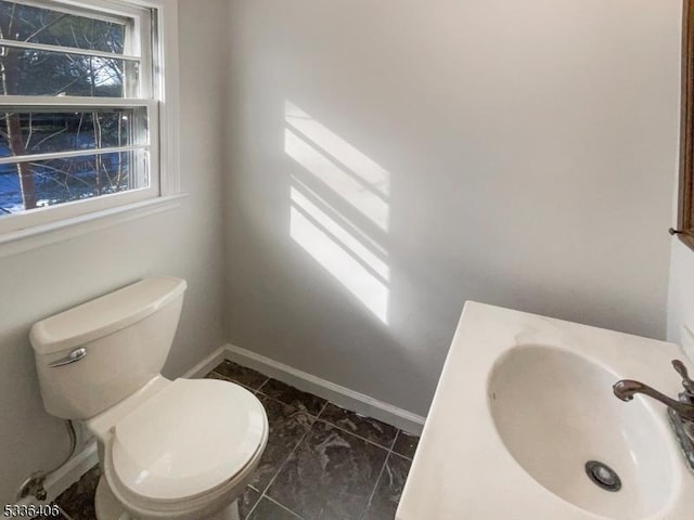 bathroom featuring sink and toilet