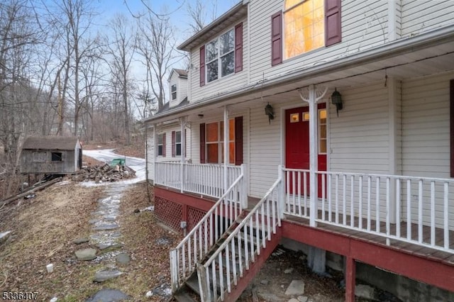 view of exterior entry with a porch