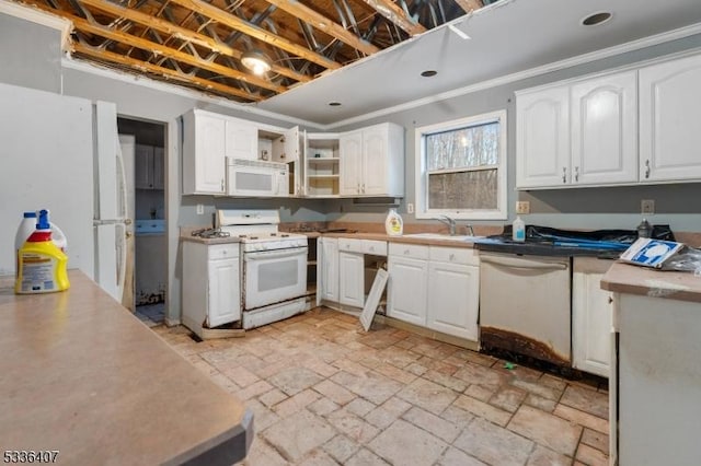 kitchen with crown molding, white appliances, sink, and white cabinets