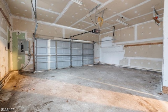 garage featuring a garage door opener and electric panel