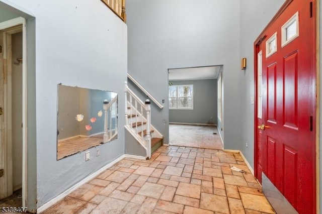 foyer entrance featuring a high ceiling