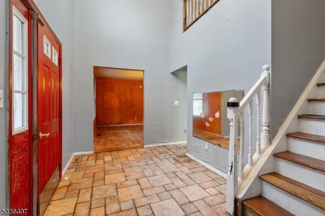 entrance foyer featuring a wealth of natural light and a high ceiling