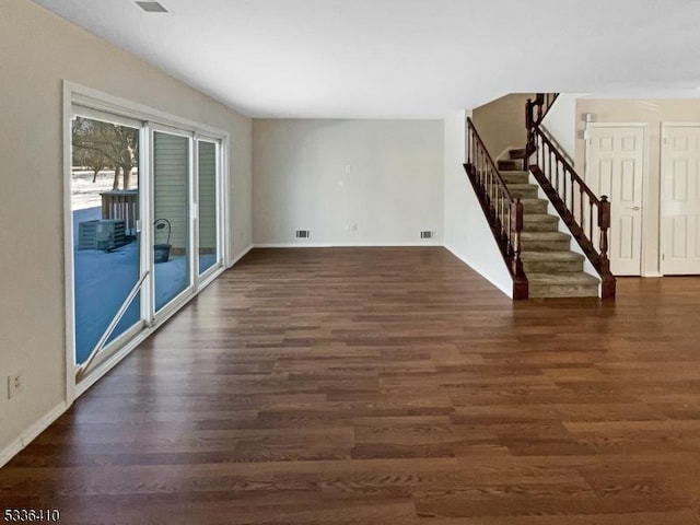 unfurnished room with dark hardwood / wood-style floors