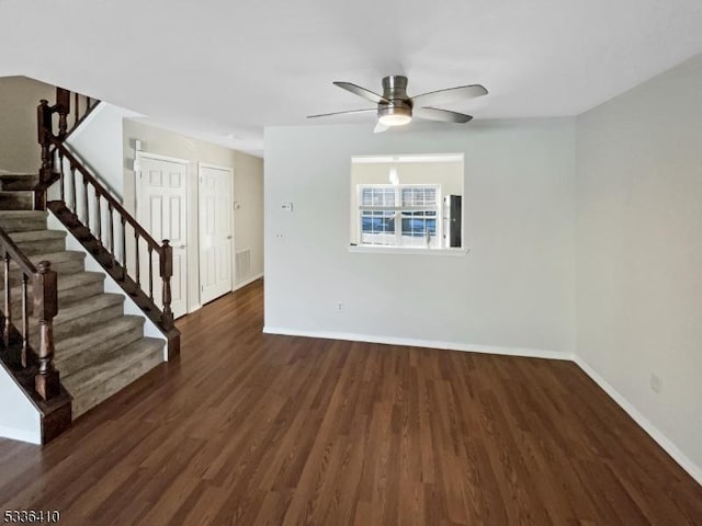 unfurnished room with dark hardwood / wood-style floors and ceiling fan