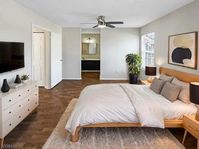 bedroom with connected bathroom, dark hardwood / wood-style floors, and ceiling fan